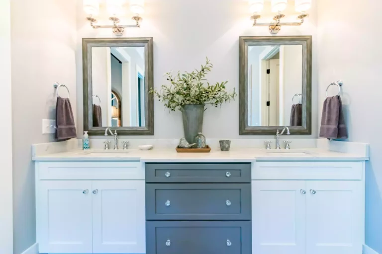 A double sink bathroom cabinet with two-tone storage options.
