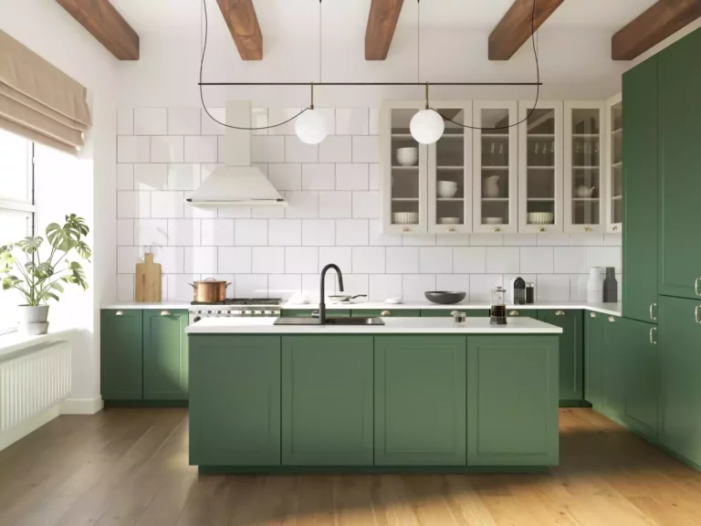 A kitchen with custom dark sage green cabinets.