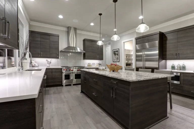 Closet Remodel with The Modern gray kitchen features dark gray flat front cabinets paired with white quartz countertops and a glossy gray linear tile back splash.